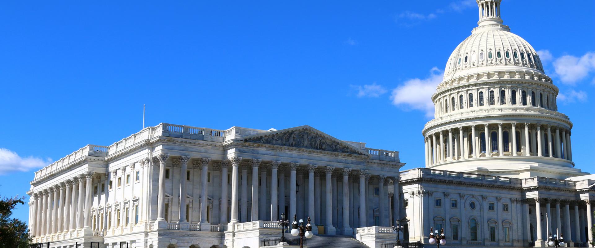 Capitol dome against blue sky